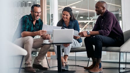 A couple speaking with a financial advisor.