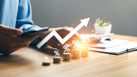 a man's hand behind a graph