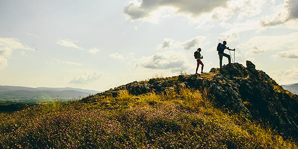 People hiking a mountain peak