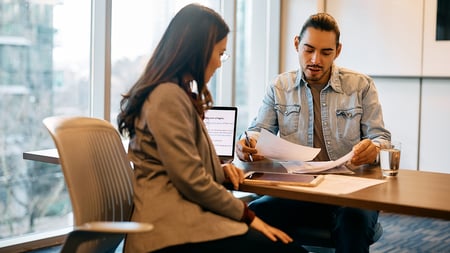 A banker discussing options with a client. 