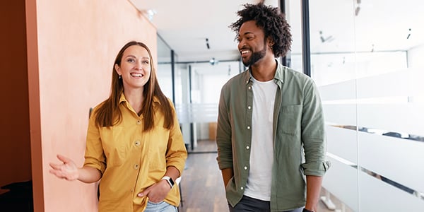 coworkers walking down a hallway