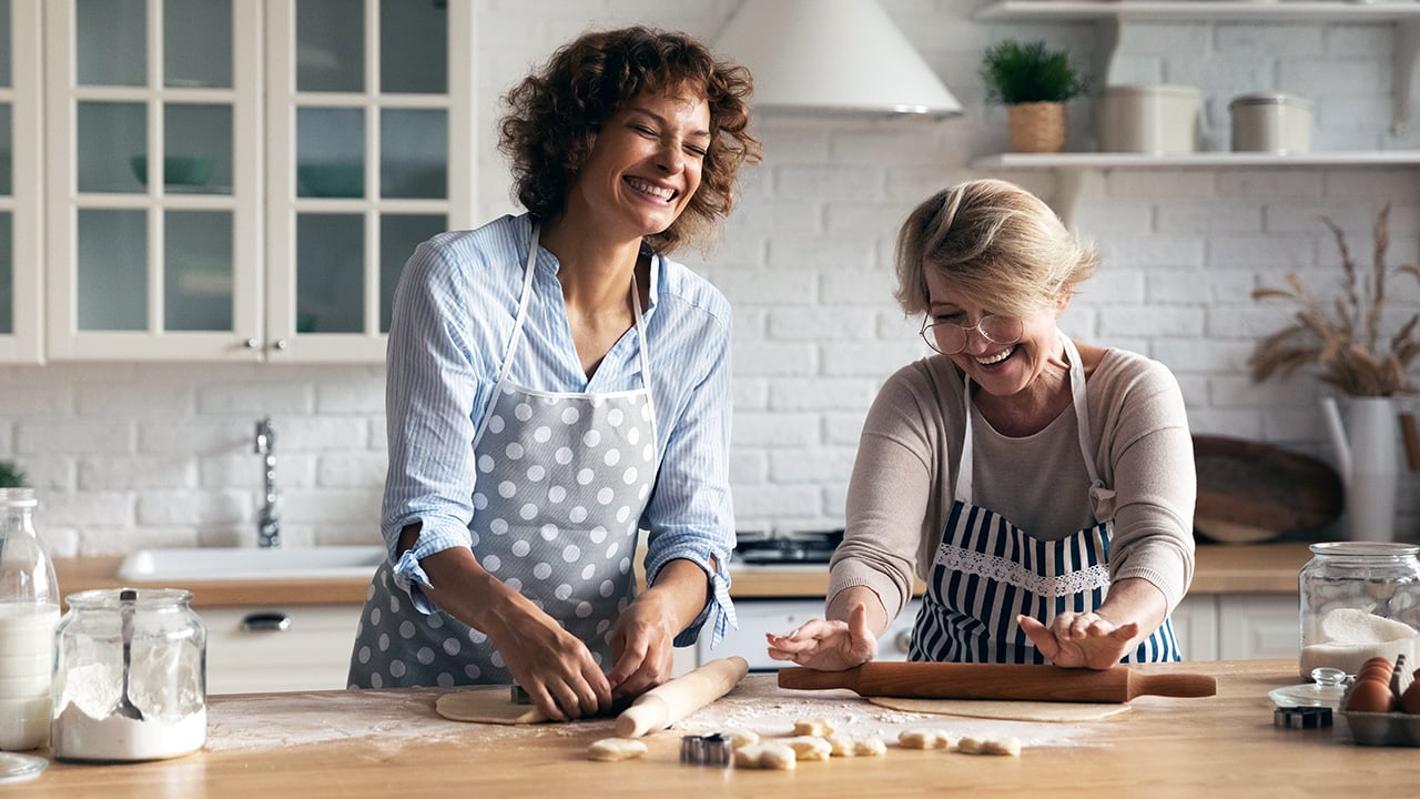 Two women in a kitchen baking