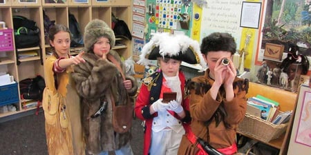 A group of kids learning history through costumes and play