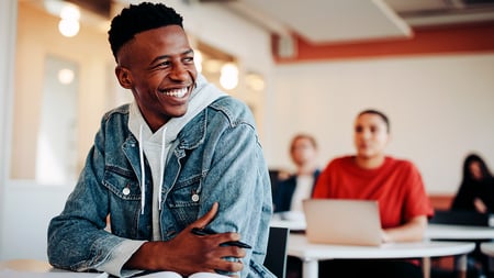A smiling student in class