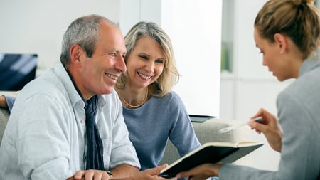 A couple consulting with an insurance agent. 