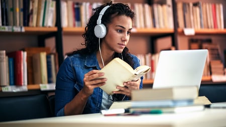 A student studying in a school library