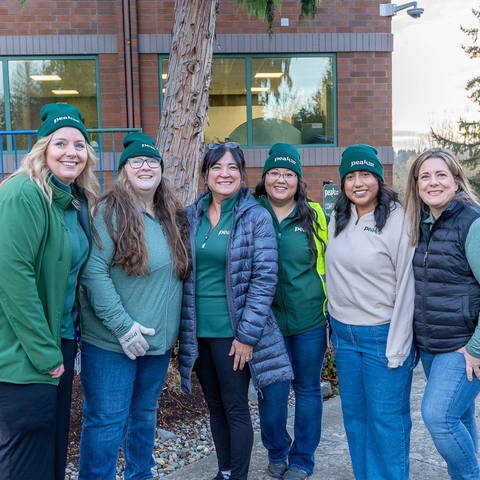 Peak employees posing. 