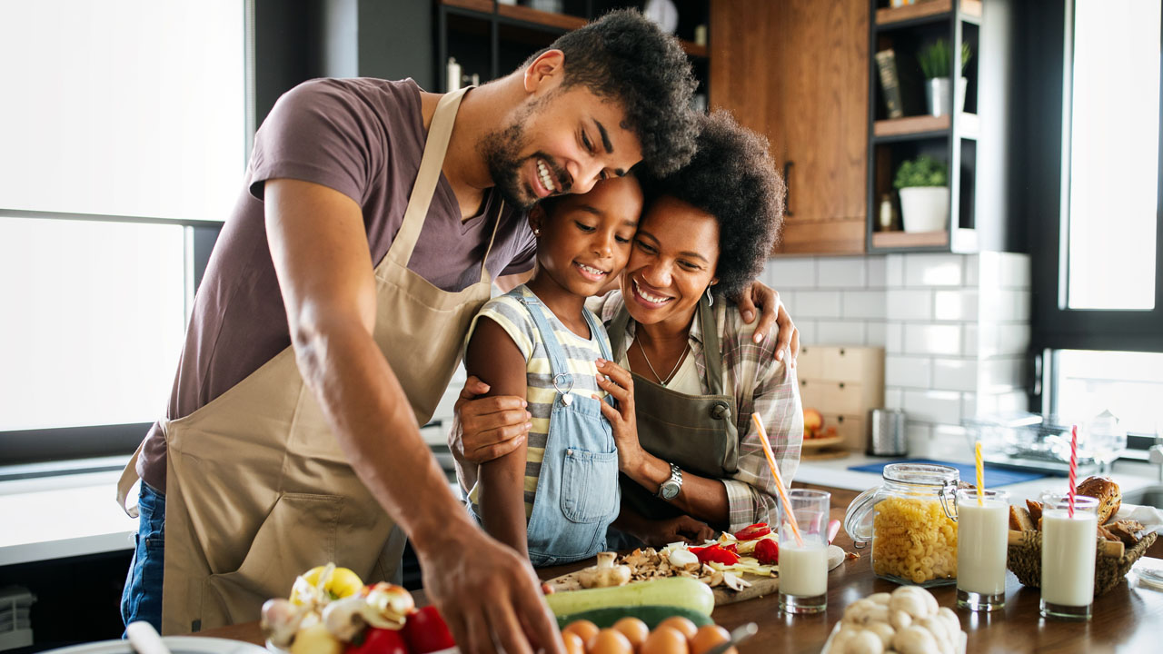 family preparing dinner toget